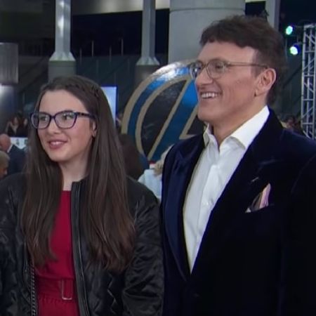 Anthony Russo and his daughter are standing next to each other talking to the interviewer.
